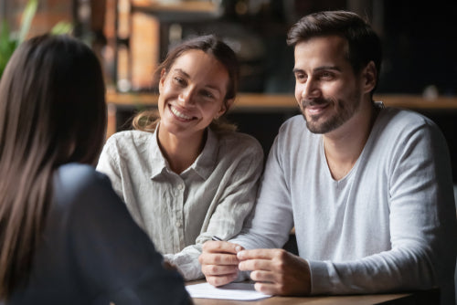 Young couple speaking with a fertility consultant at a fertility clinic