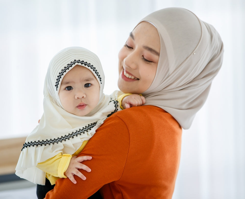 mother holding her baby